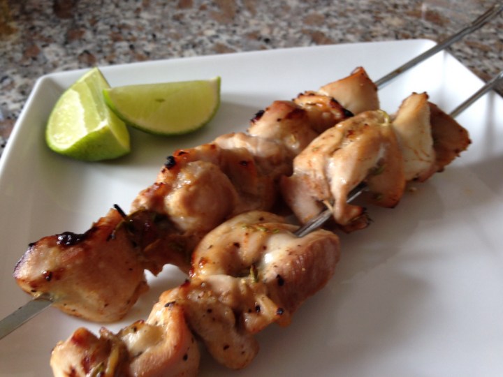 Grilled chicken skewers with a squeeze of lime