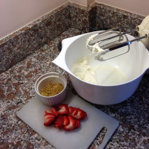 Stawberries, cream and crushed pistachios just add the biscuits!