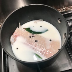 Poach the fish, bay leaves & black peppercorns gently in milk